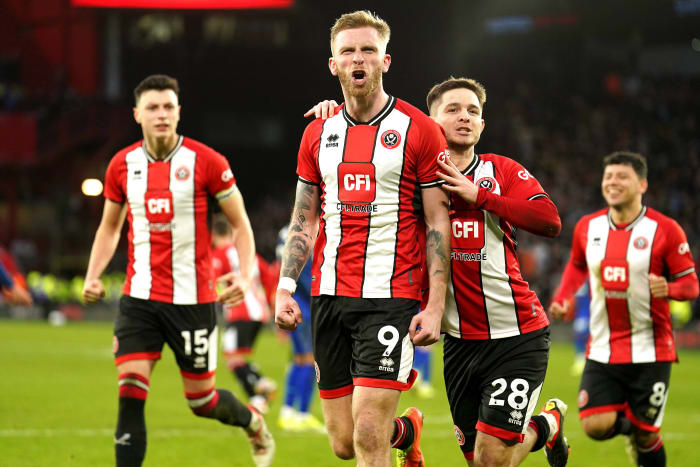 Sheffield United striker Oli McBurnie pictured (center) celebrating after scoring the latest goal in Premier League history by converting a penalty kick in the 103rd minute of his team's 2-2 draw against West Ham in January 2024
